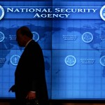 national-intelligence-director-john-negroponte-past-a-video-screen-at-national-security-agency-at-fort-meade