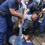 hungarian-policemen-detain-migrants-on-the-tracks-as-they-wanted-to-run-away-at-the-railway-station-in-the-town-of-bicske