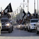 militant-islamist-fighters-parade-on-military-vehicles-along-the-streets-of-northern-raqqa-province