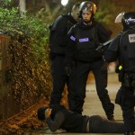 a-man-lies-on-the-ground-as-french-police-check-his-identity-near-the-bataclan-concert-hall-following-fatal-shootings-in-paris-france