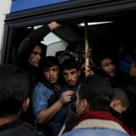refugees-and-migrants-are-squeezed-inside-a-bus-after-arriving-by-the-blue-star-patmos-passenger-ship-at-the-port-of-piraeus-near-athens