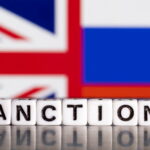 file-photo-illustration-shows-letters-arranged-to-read-sanctions-in-front-of-union-jack-and-russian-flag-colors