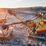 mining-excavator-loading-granite-or-ore-into-dump-truck