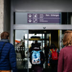 men-and-women-walking-to-the-non-schengen-door-airport