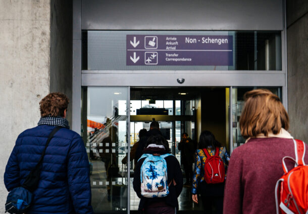 men-and-women-walking-to-the-non-schengen-door-airport