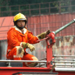 the-fireman-is-preparing-to-put-out-the-fire-at-the-fire-engine